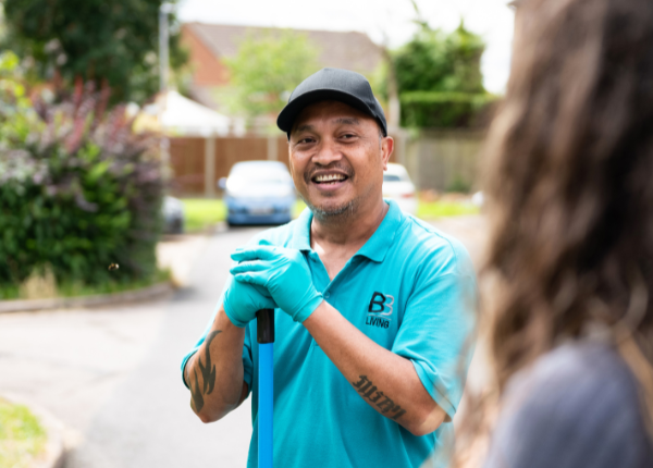 Neighbourhood staff talking to customer