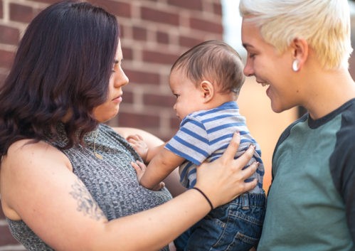 two women with a baby