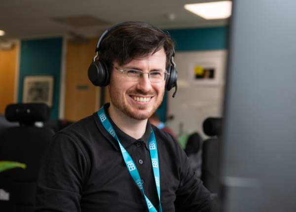 Guy in call centre taking calls