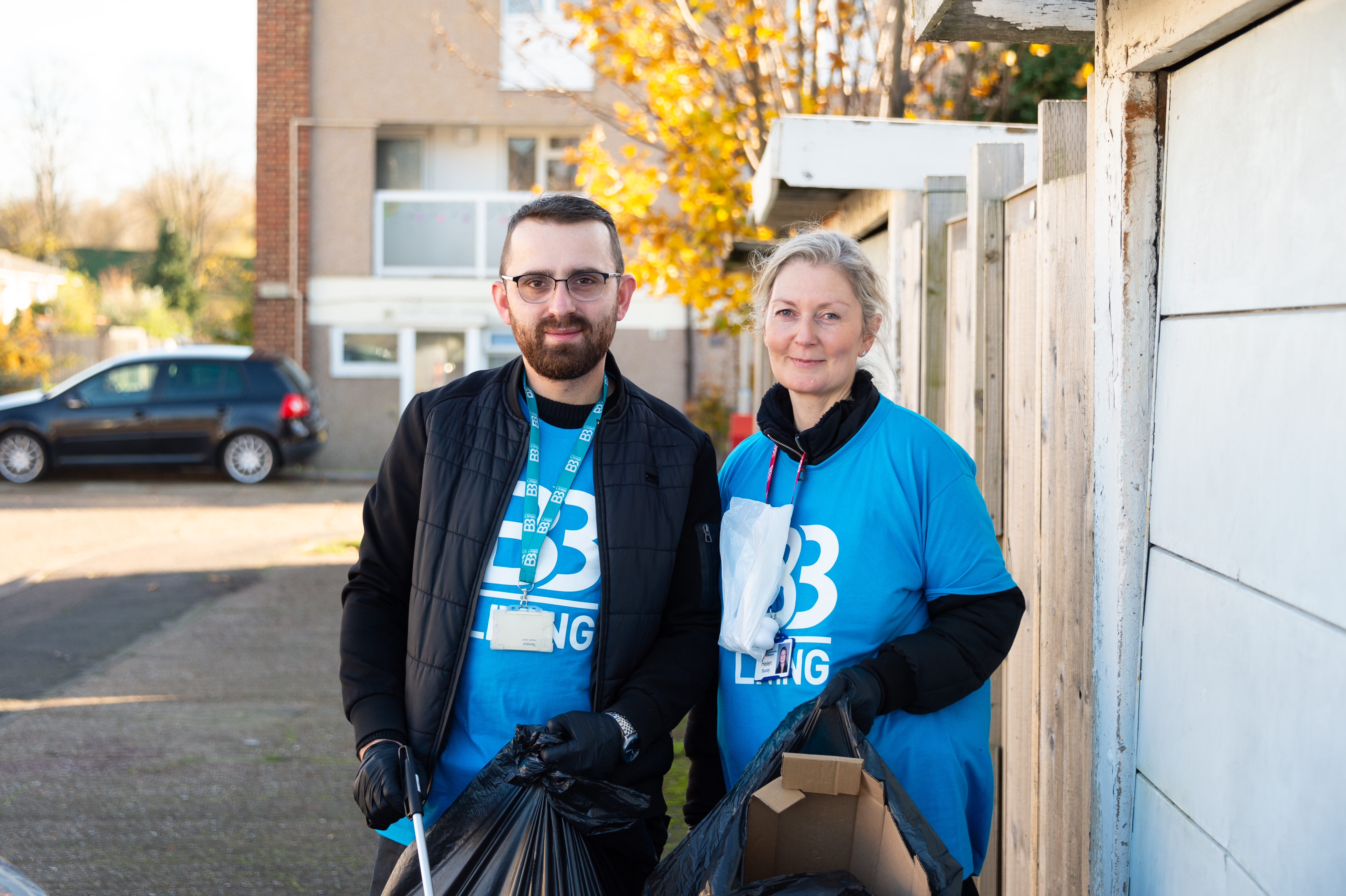 2 staff members at a clean up day