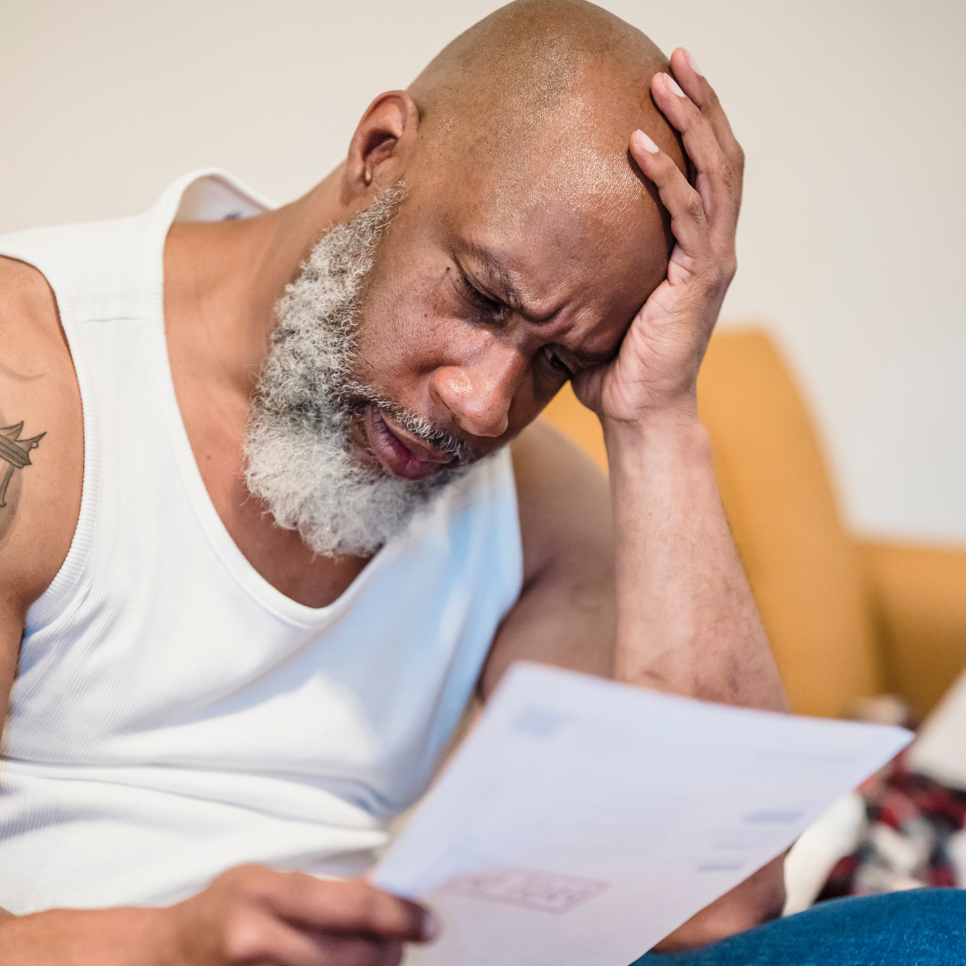 Man looking at letter